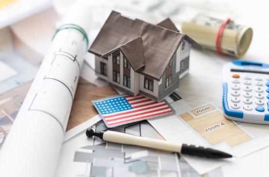 VA construction-to-permanent loan concept showing home blueprints, a custom house model, and U.S. flag representing Veteran home financing